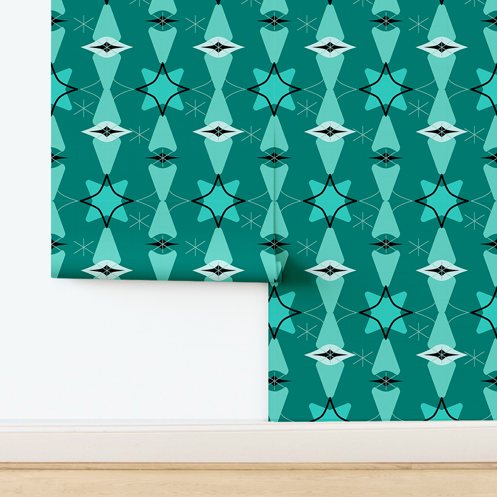 The artwork features a repeating geometric pattern of symmetrical shapes resembling elongated, curved diamonds or petals in various shades of blue and green. Each shape is split vertically with one half filled with a light blue and the other half filled with green or darker blue. The background is a light, almost pastel blue, which provides a soft yet vibrant backdrop. One of the blue shapes near the upper left contains a white starburst element, adding a focal point of brightness to the composition. The overall design conveys a modern, mid-century aesthetic with clean lines and harmonious color contrasts.